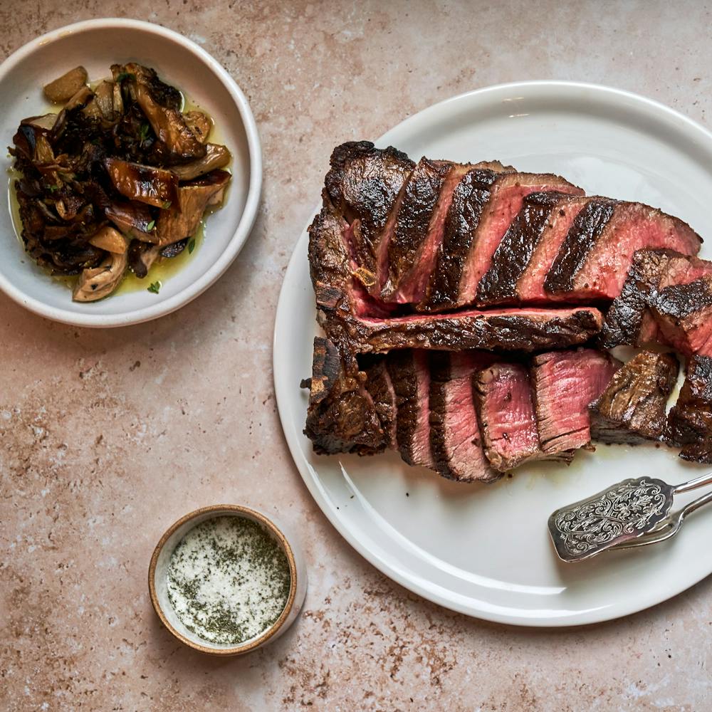 a plate topped with different types of food on a table