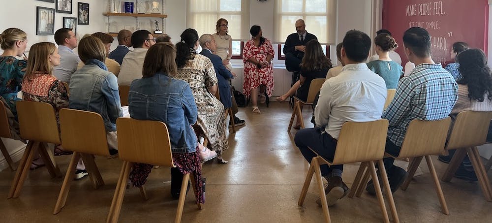 a group of people sitting at a table