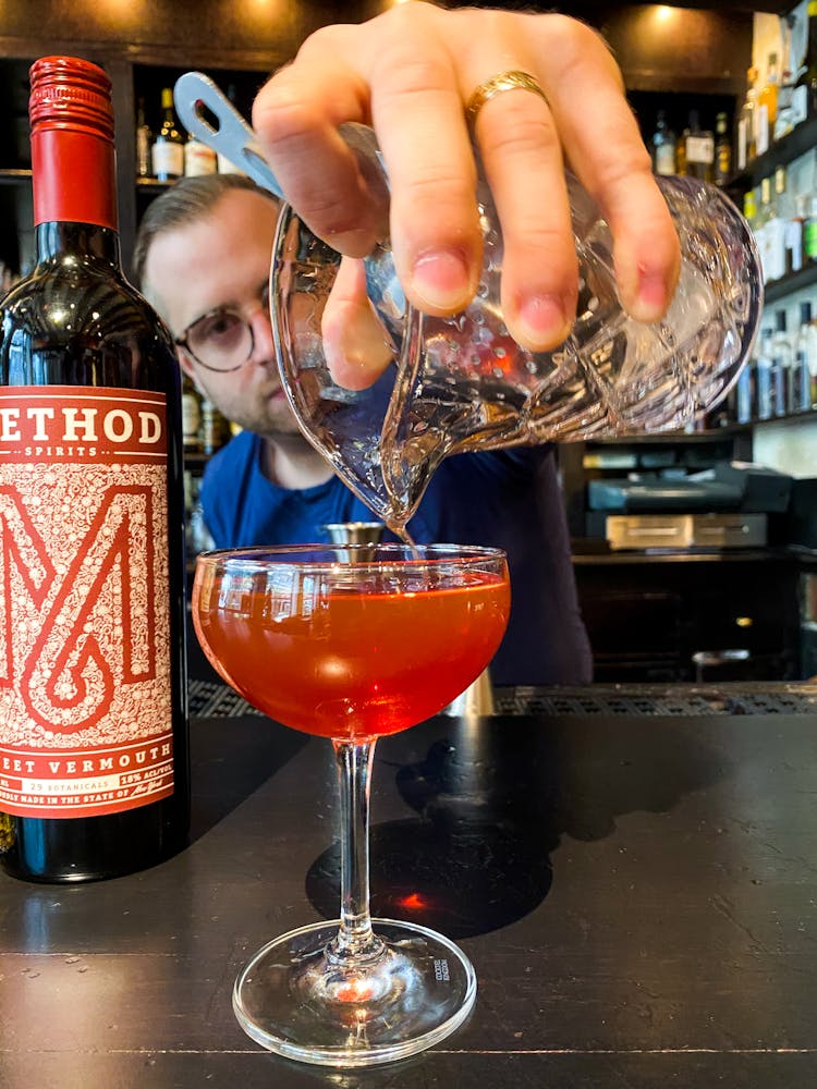 a person in a striped shirt and smiling at the camera