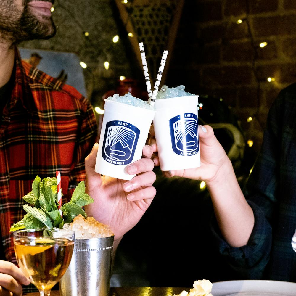 a group of people sitting at a table in a restaurant
