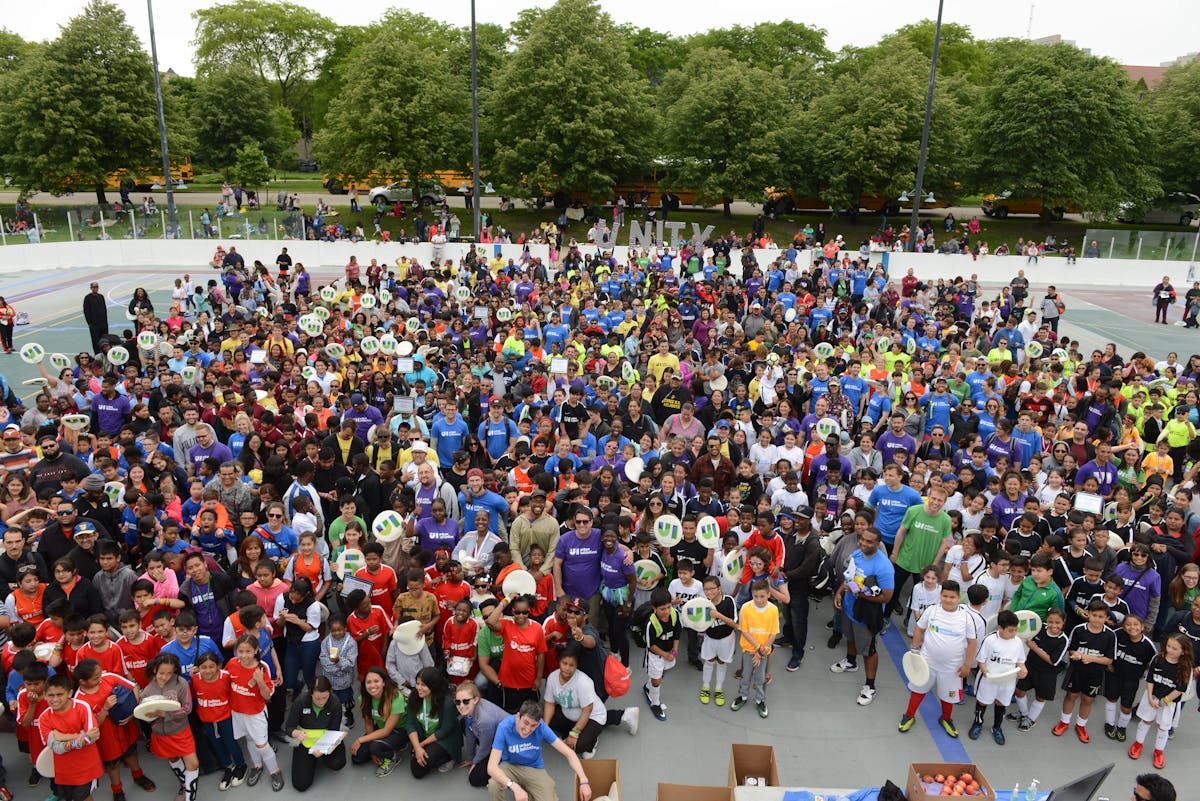 a group of people in front of a large crowd of people
