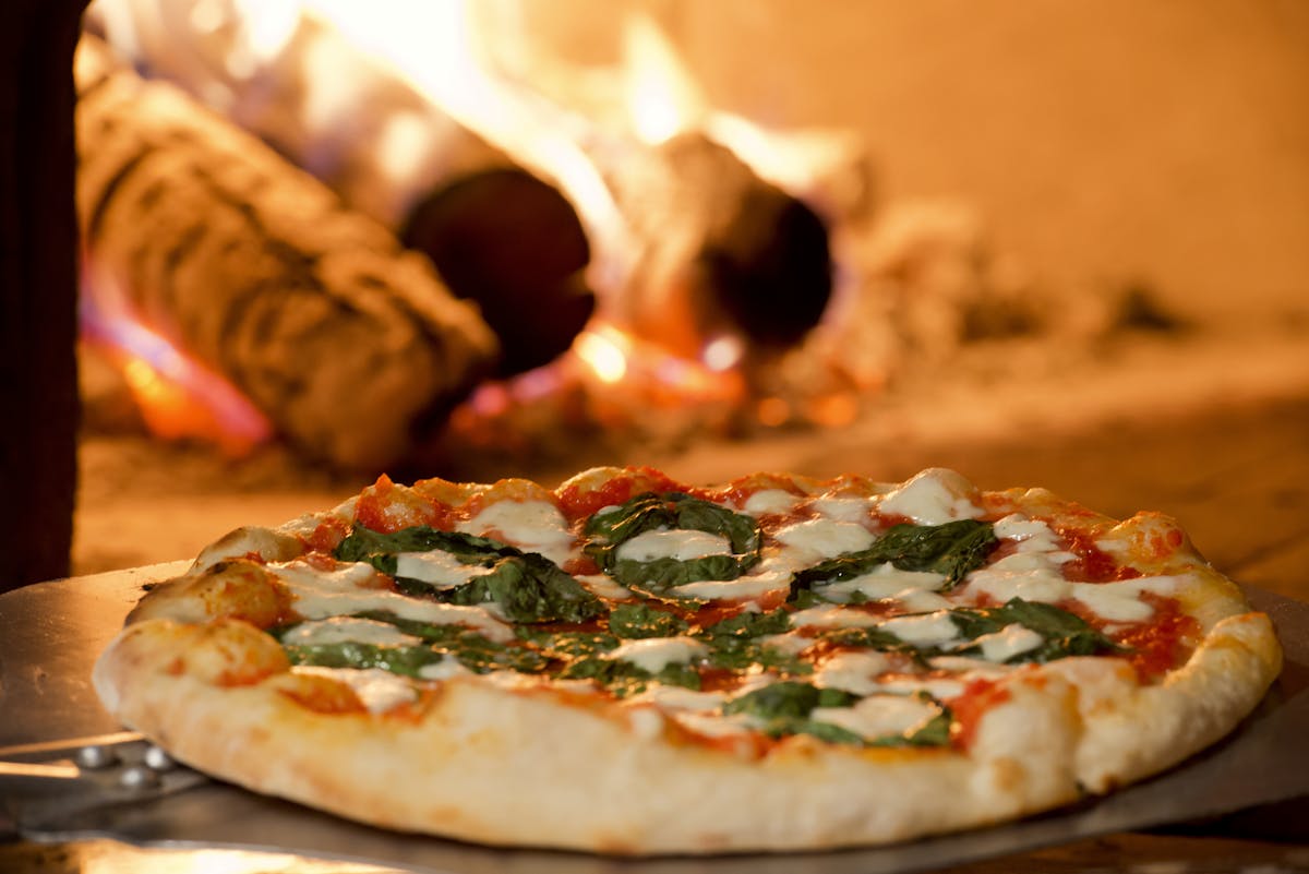 a pizza sitting on top of a table