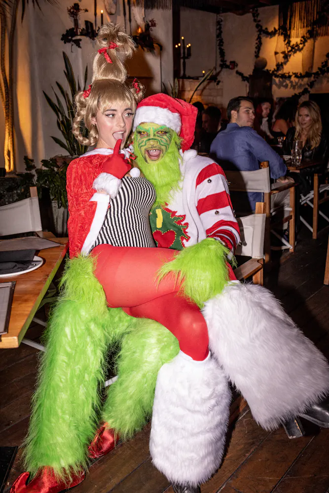 a person holding a colorful teddy bear