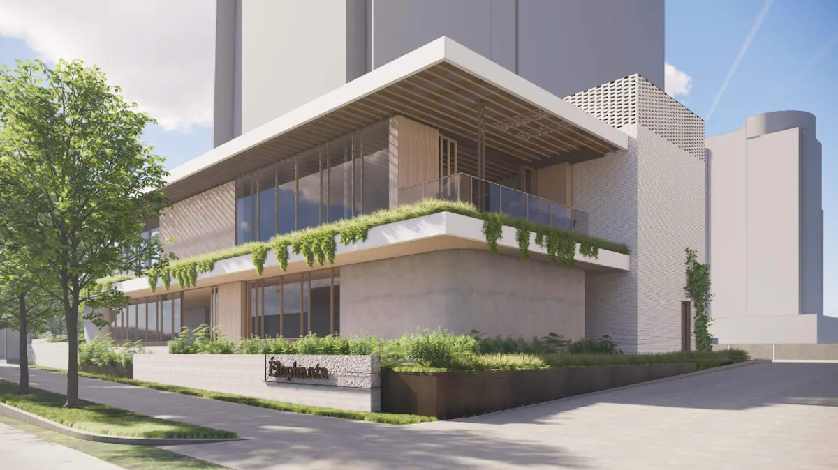 a building with plants on the roof