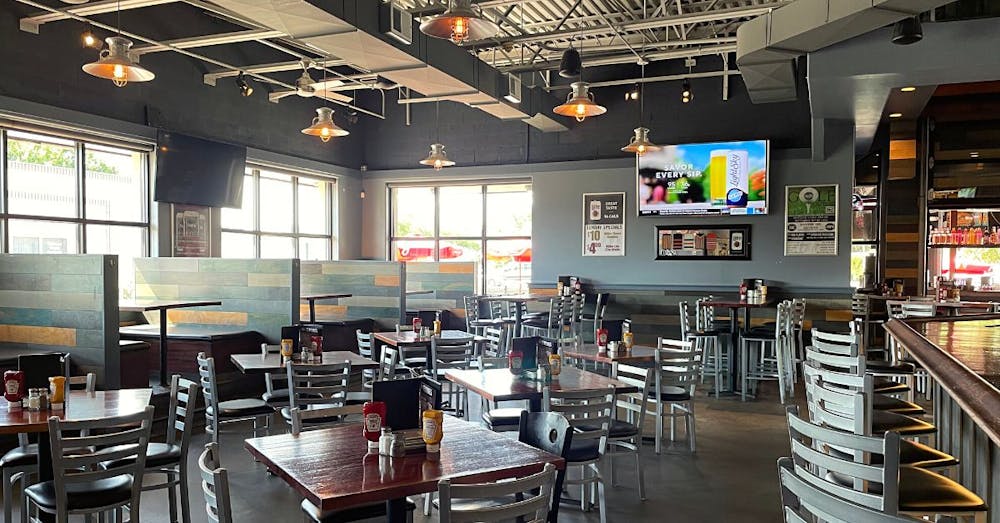 a room filled with furniture and a table in a restaurant