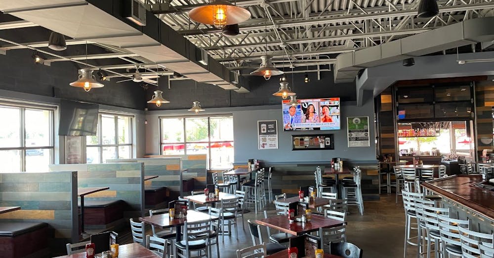 a kitchen with a table in a restaurant