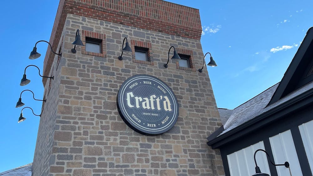 a large brick tower with a clock on the side of a building