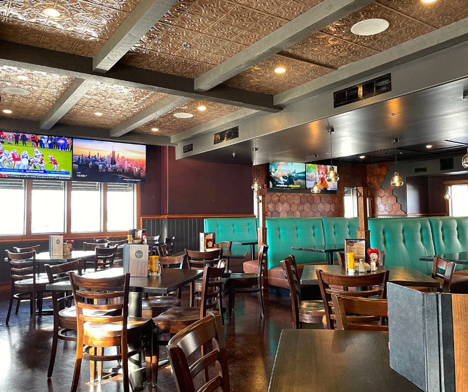 a room filled with furniture and a table in a restaurant