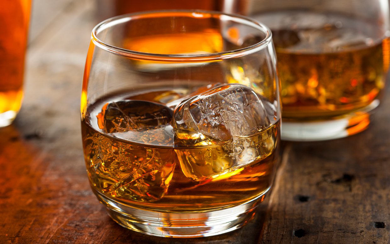 a glass with bourbon