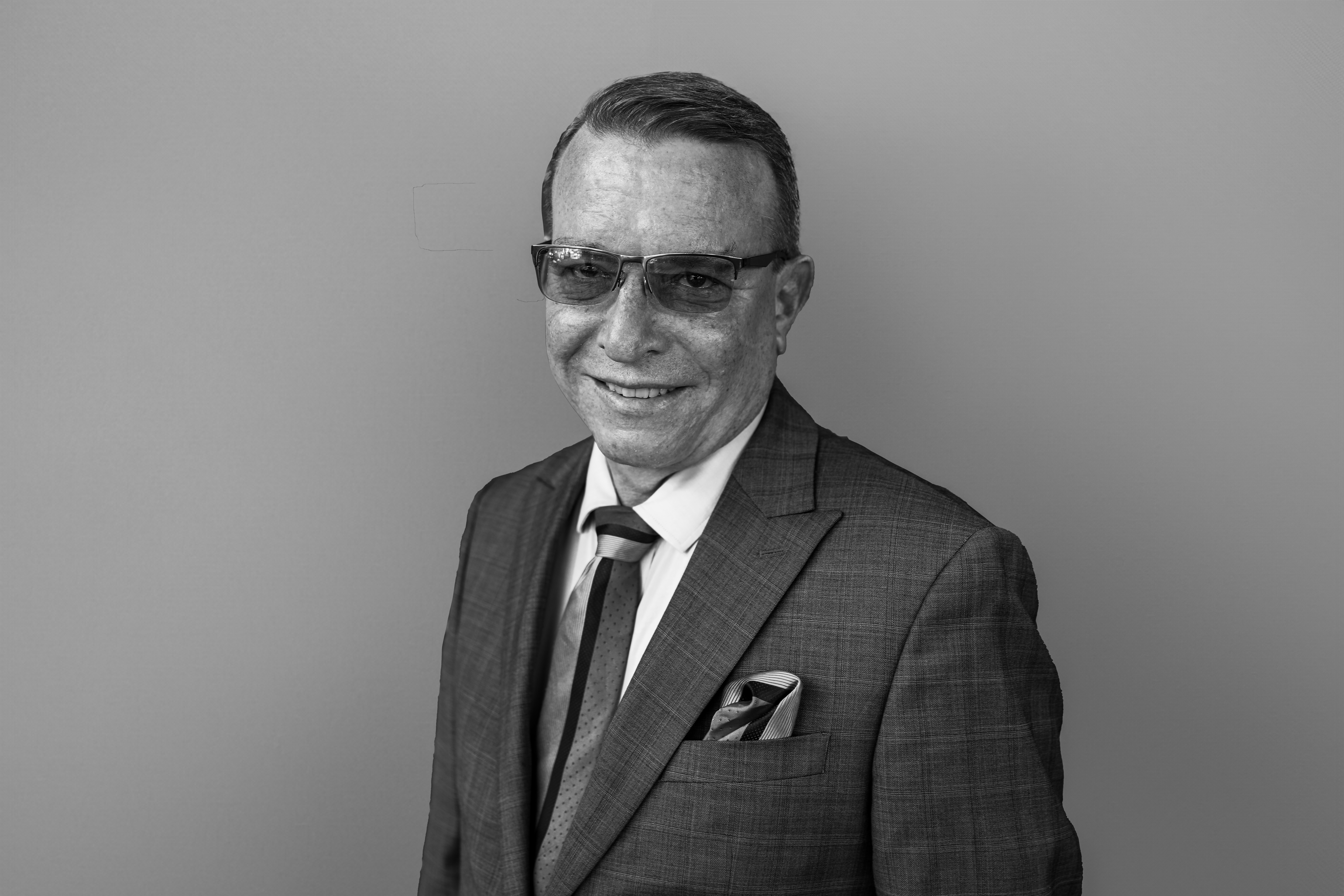 a man posing and smiling