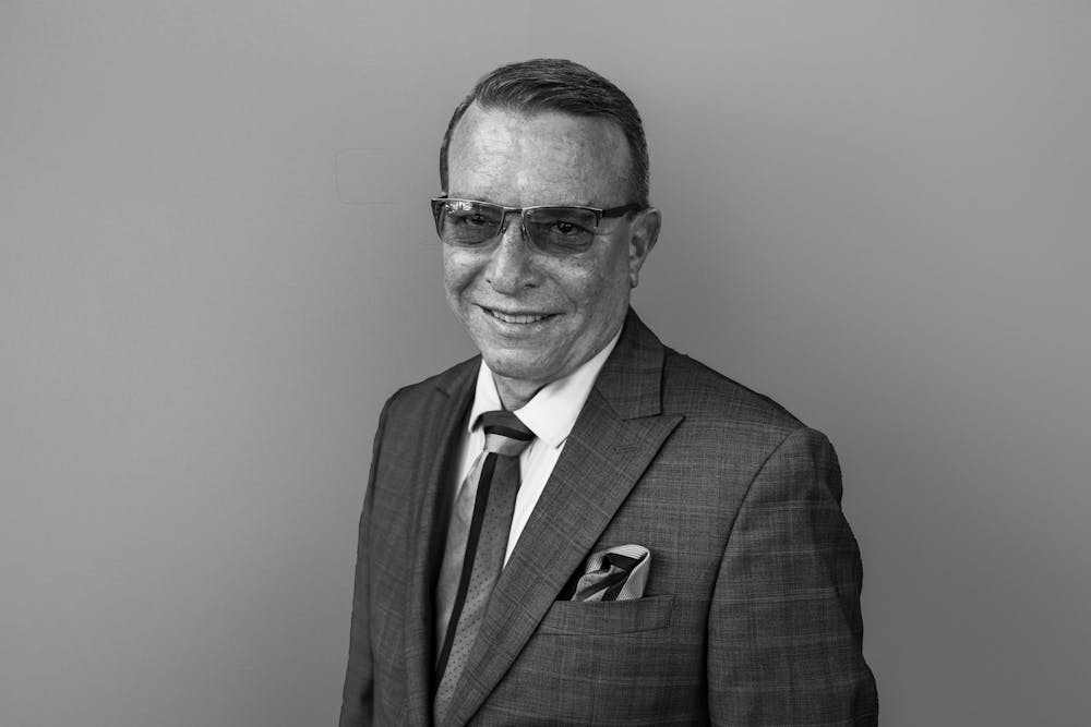 a man posing and smiling