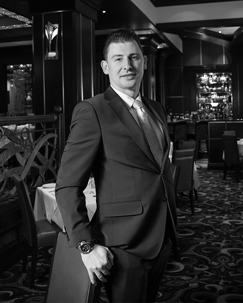 a man posing and smiling