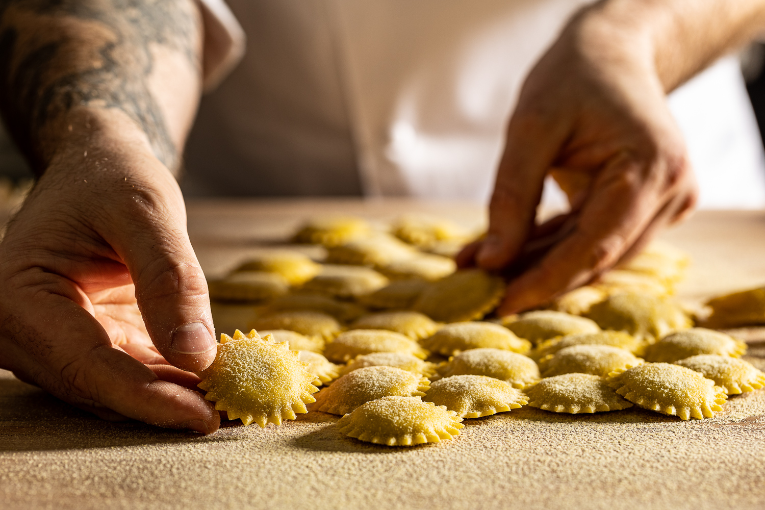 a close up of a person cutting a piece of food