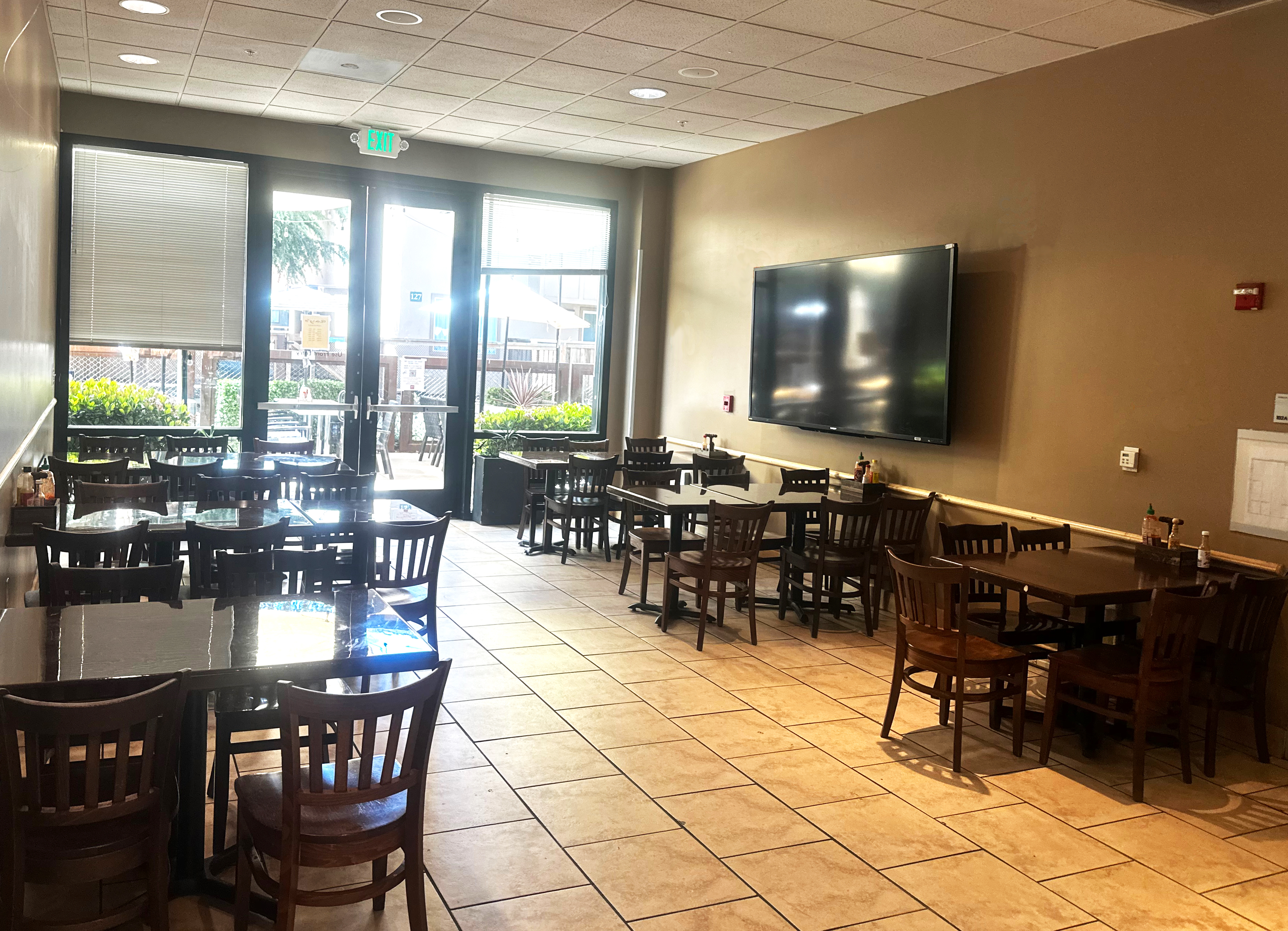a dining room table in front of a window