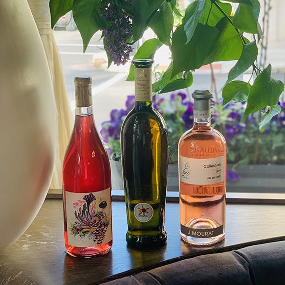 a close up of a bottle of wine on a table