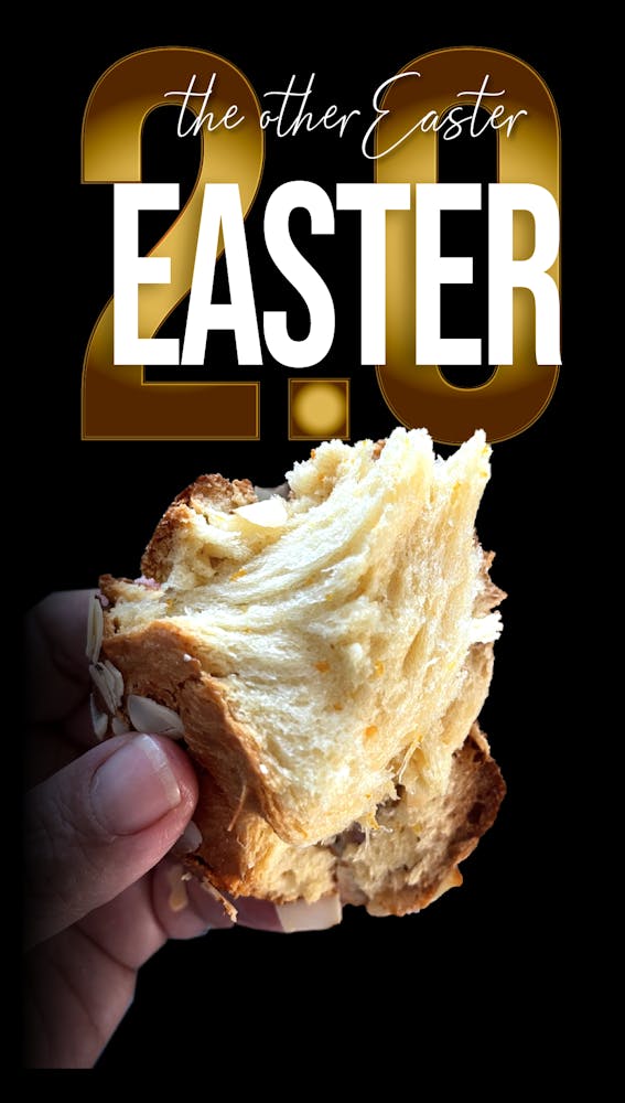 a hand holding a half eaten sandwich