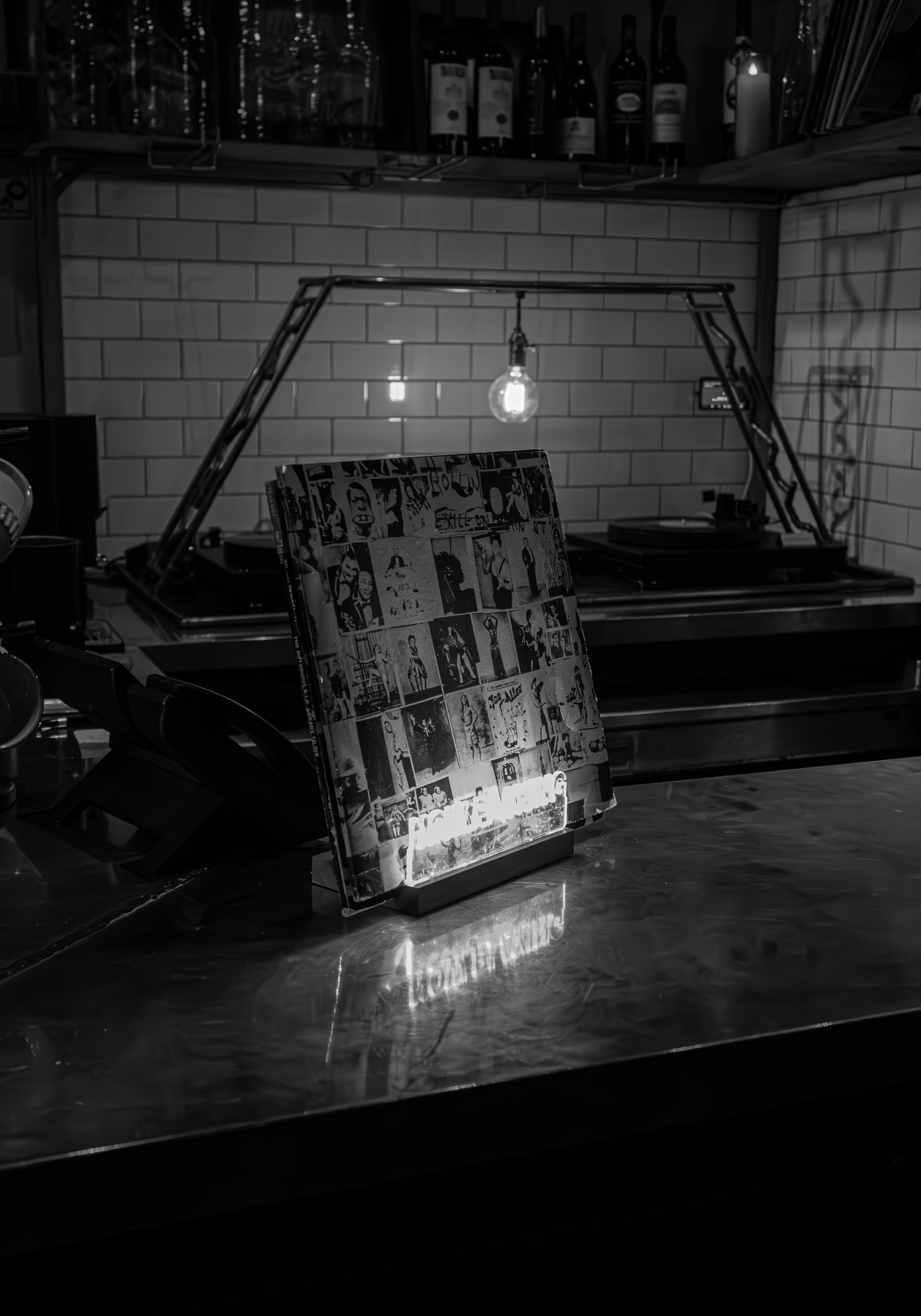 a black and white photo of a sign on a table