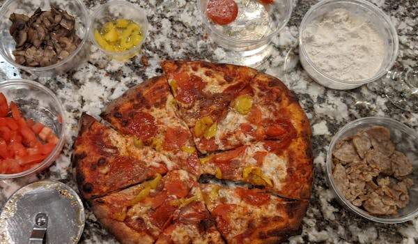 a pizza sitting on top of a pan on a table