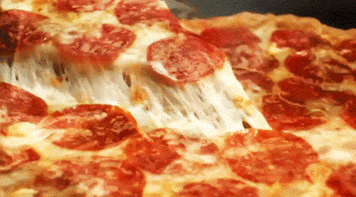 a pizza sitting on top of a pan covered in cheese and pepperoni