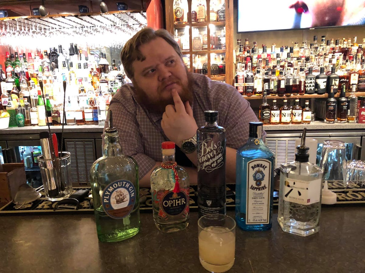 a person sitting at a table in front of a store