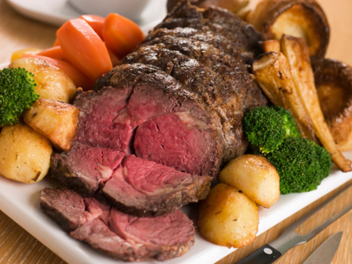 a plate of food with meat and vegetables