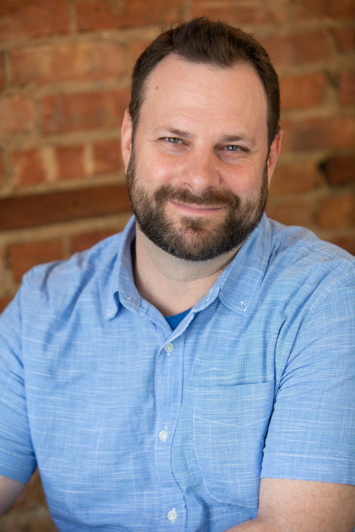 a man in a blue shirt