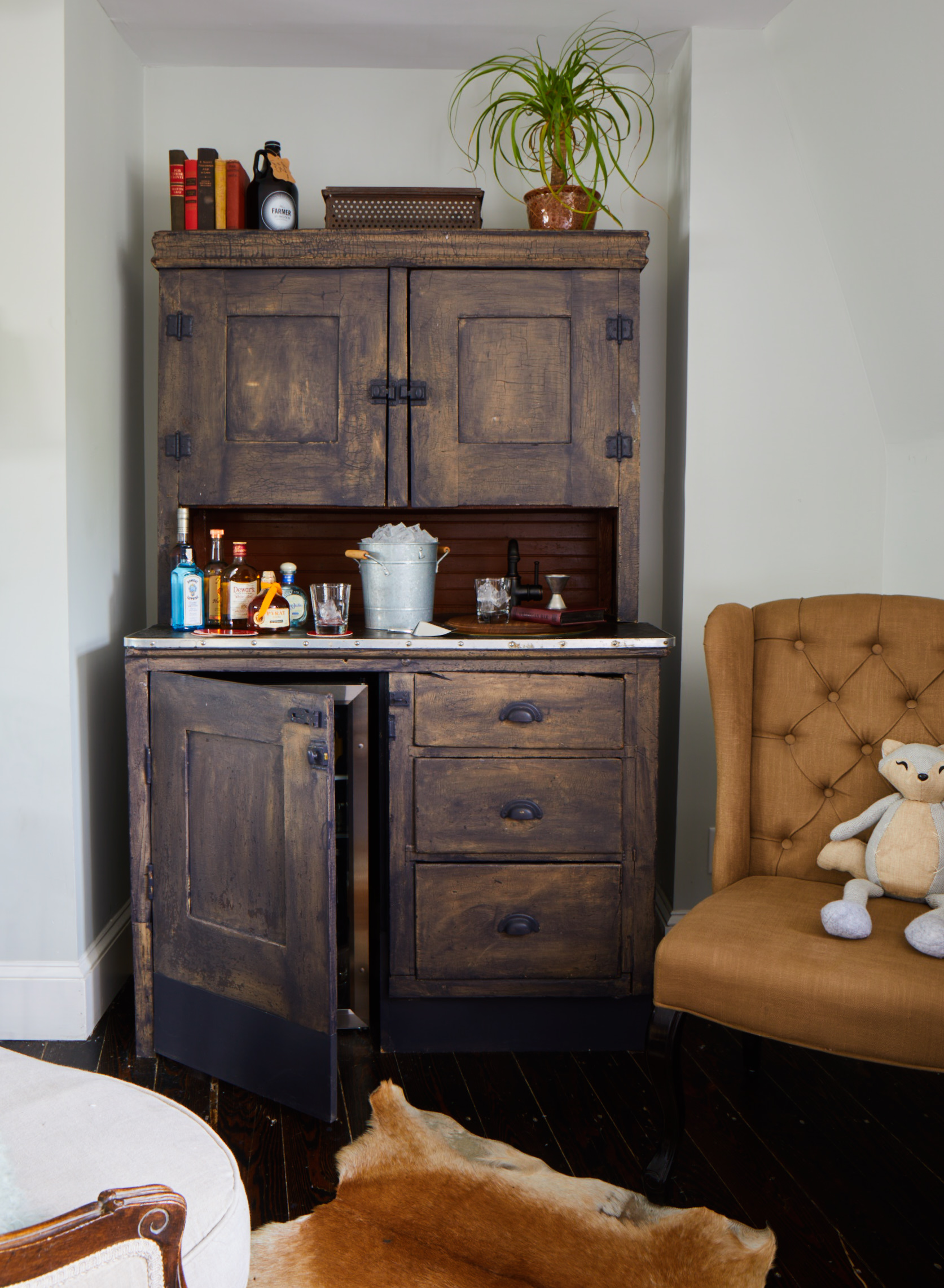 a dog sitting on a chair in a room