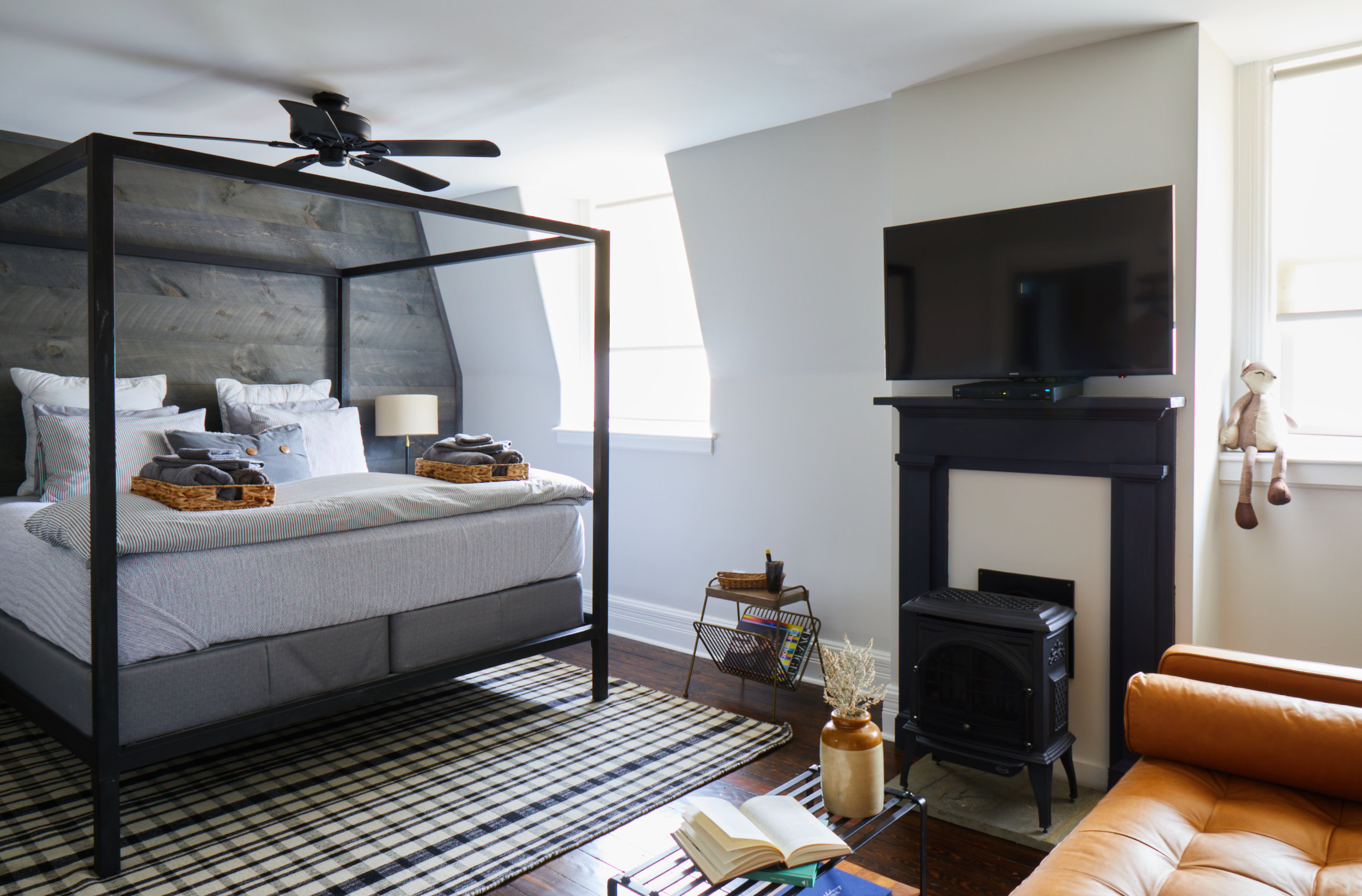 a living room filled with furniture and a large window