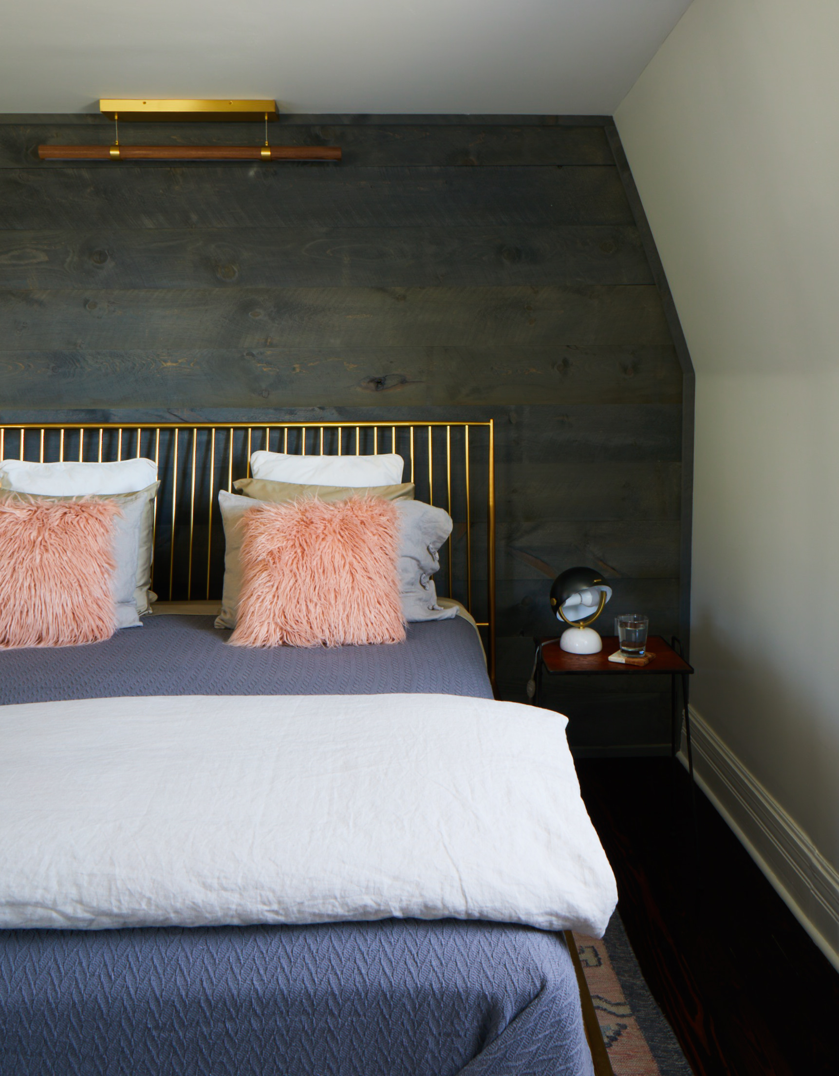 a bedroom with a bed in a room