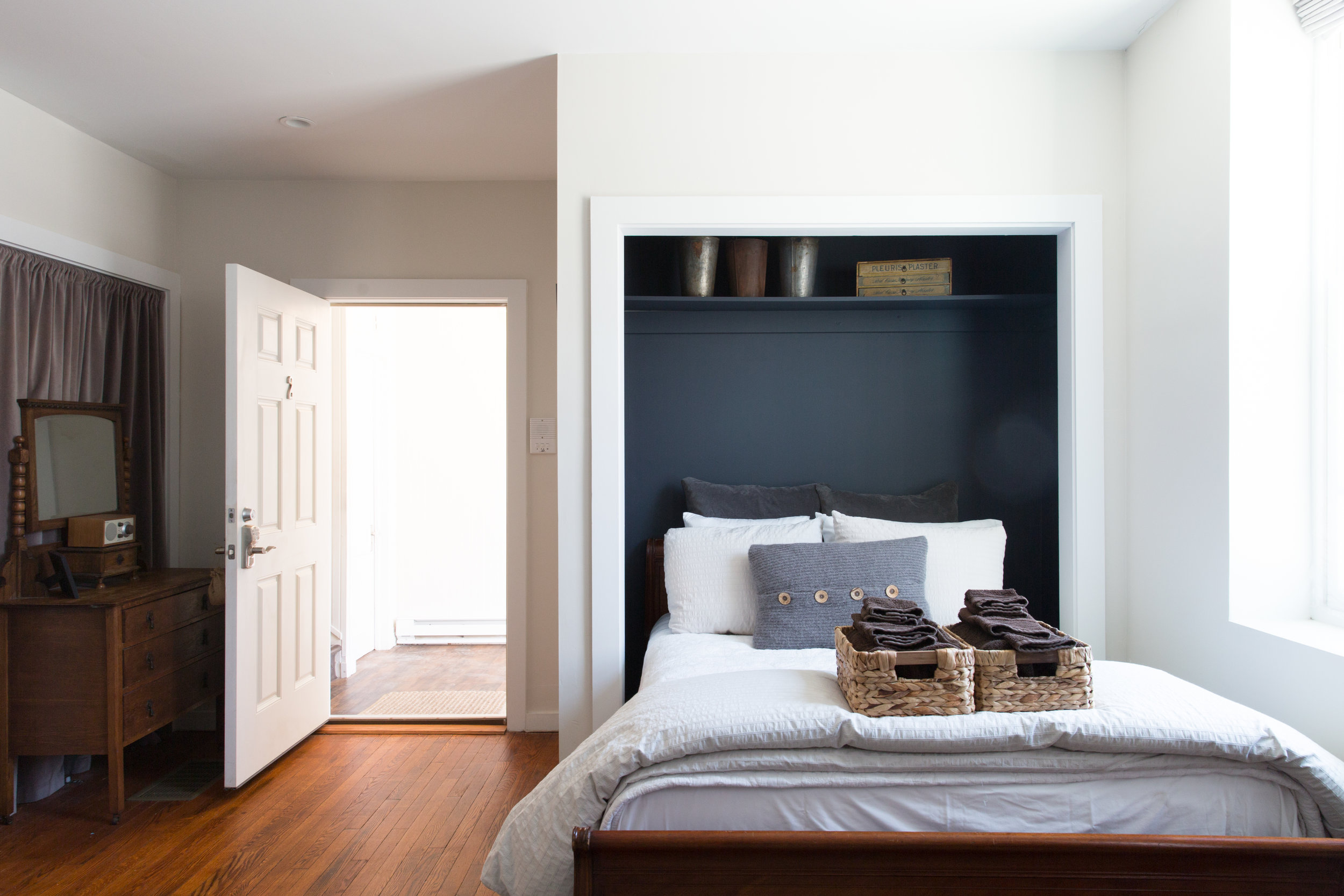 a bedroom with a large bed in a room
