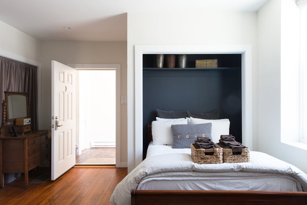 a bedroom with a large bed in a room