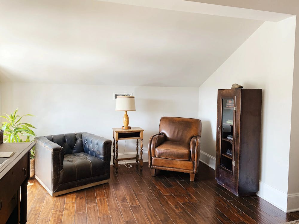 a living room filled with furniture and a tv