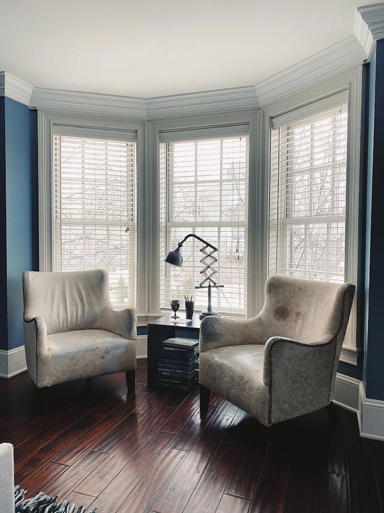 a living room filled with furniture and a large window