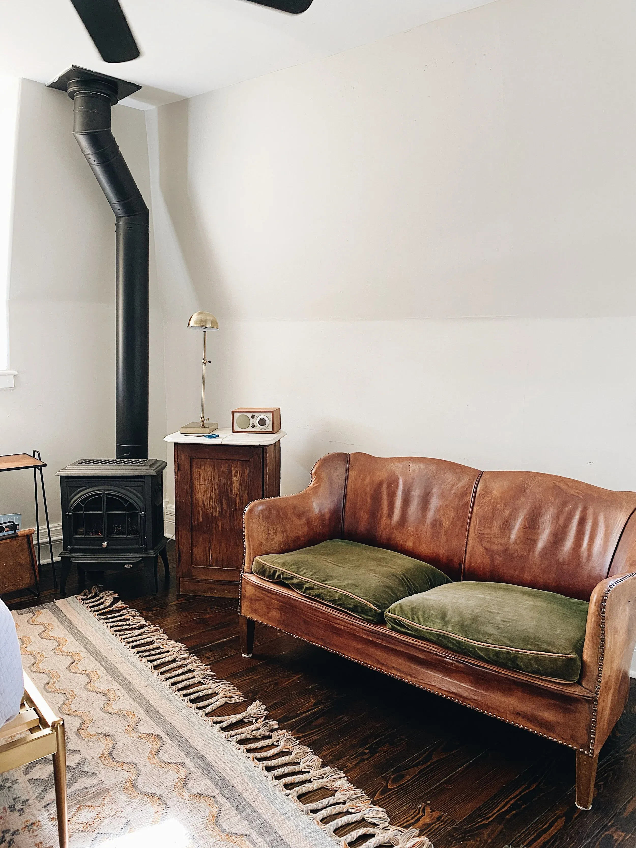 a brown leather couch in a living room