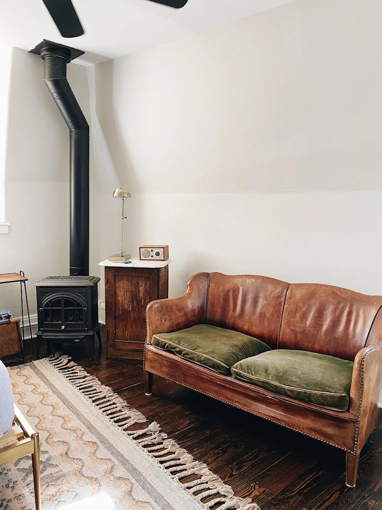 a brown leather couch in a living room