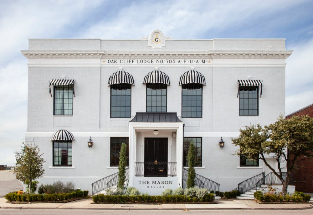 a small clock tower in front of a house