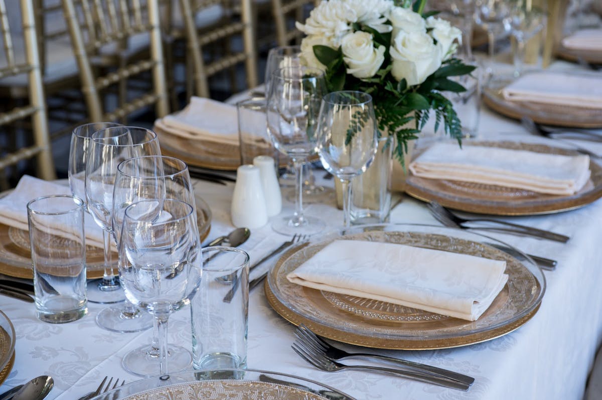 a dining table with wine glasses