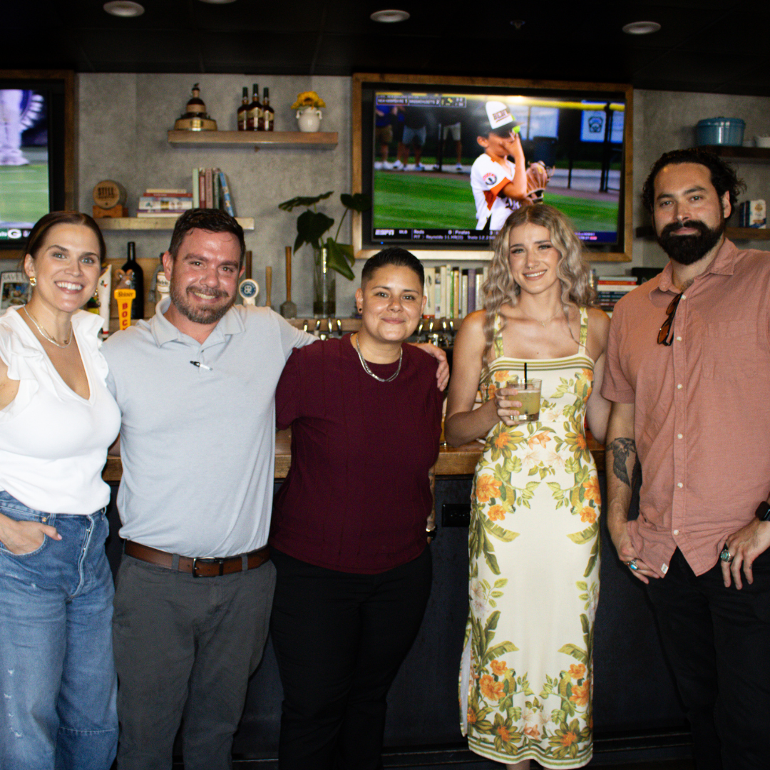 a group of people smiling at gatherings event space in dallas