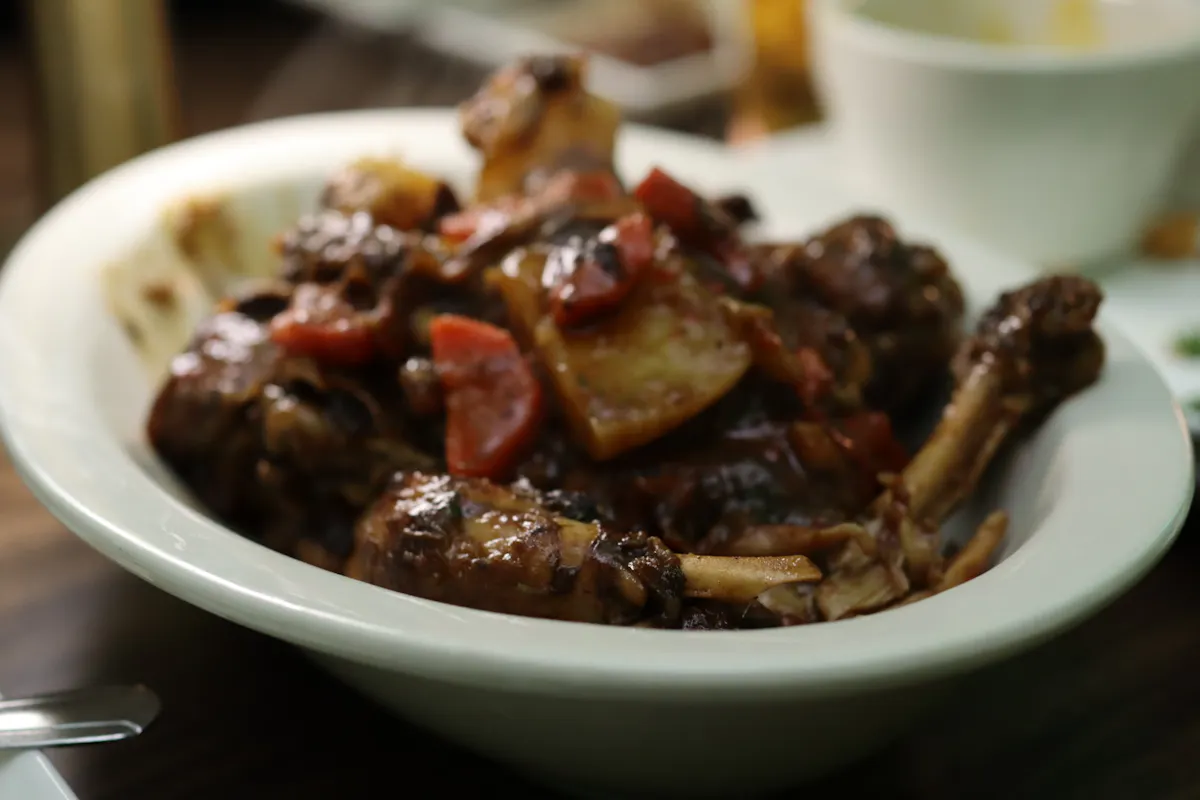 a close up of a plate of food with stew