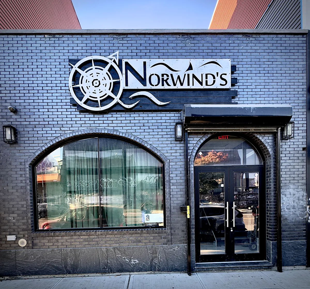 a sign in front of a building