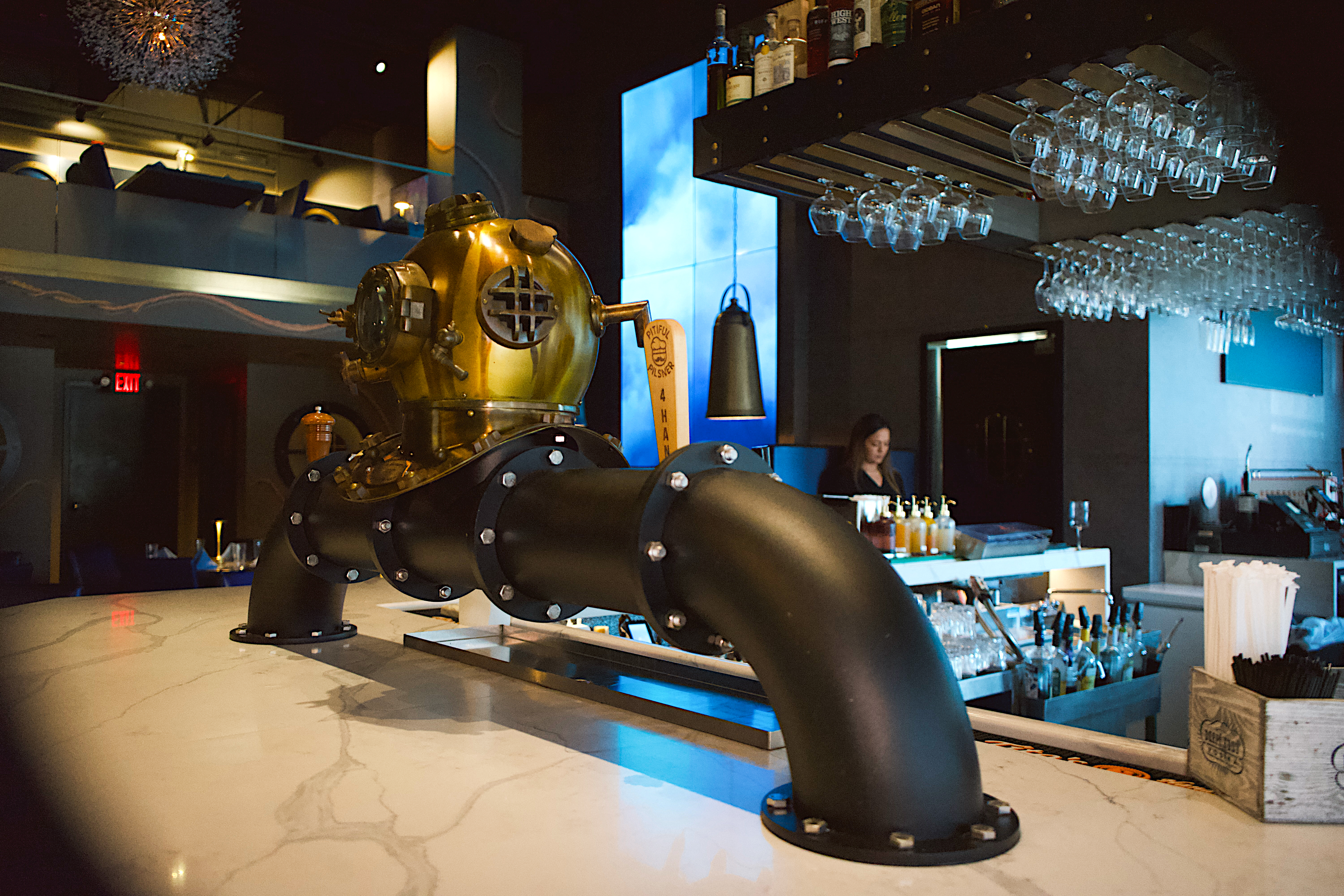 a bar with a gold and black pipe