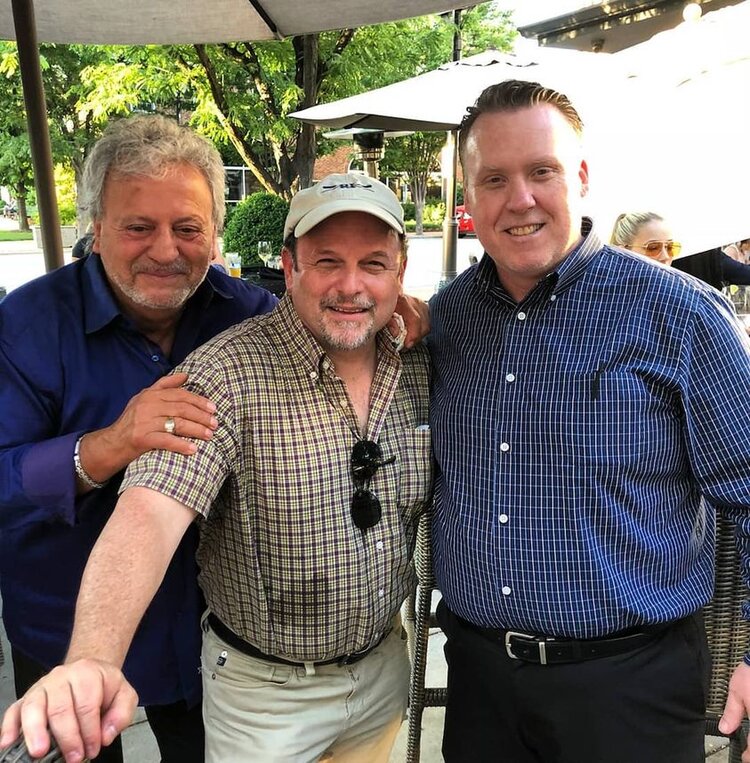 Erkan Oğur et al. posing for the camera