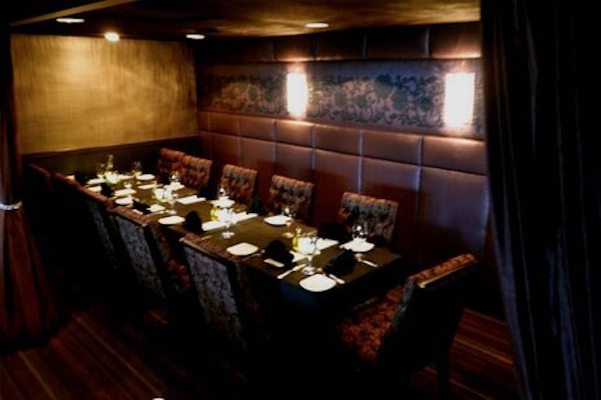 a kitchen with a table in a dark room