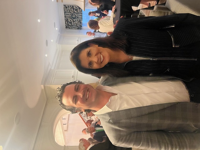 a person standing in front of Nikki Haley et al. posing for the camera