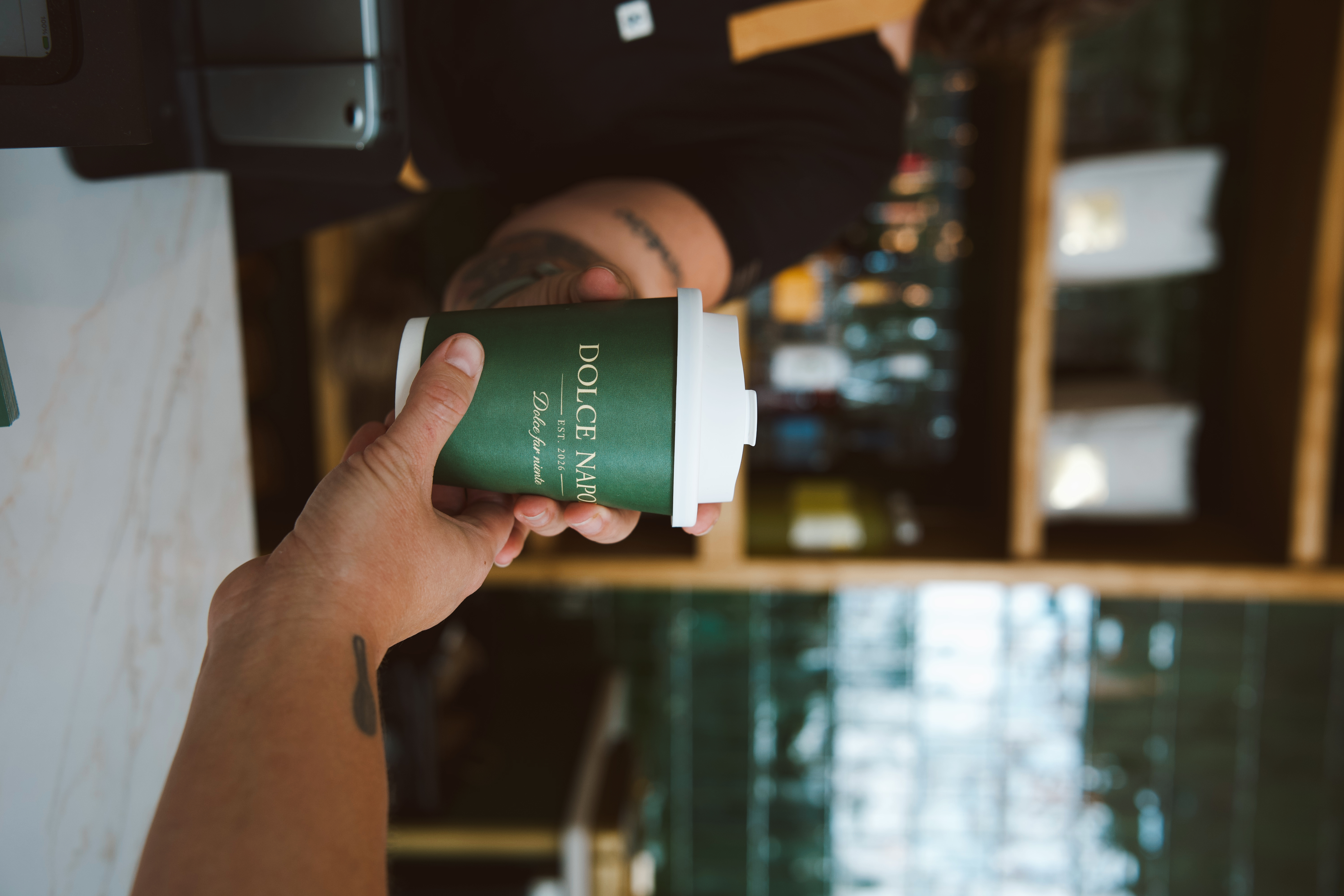 a person holding a cup