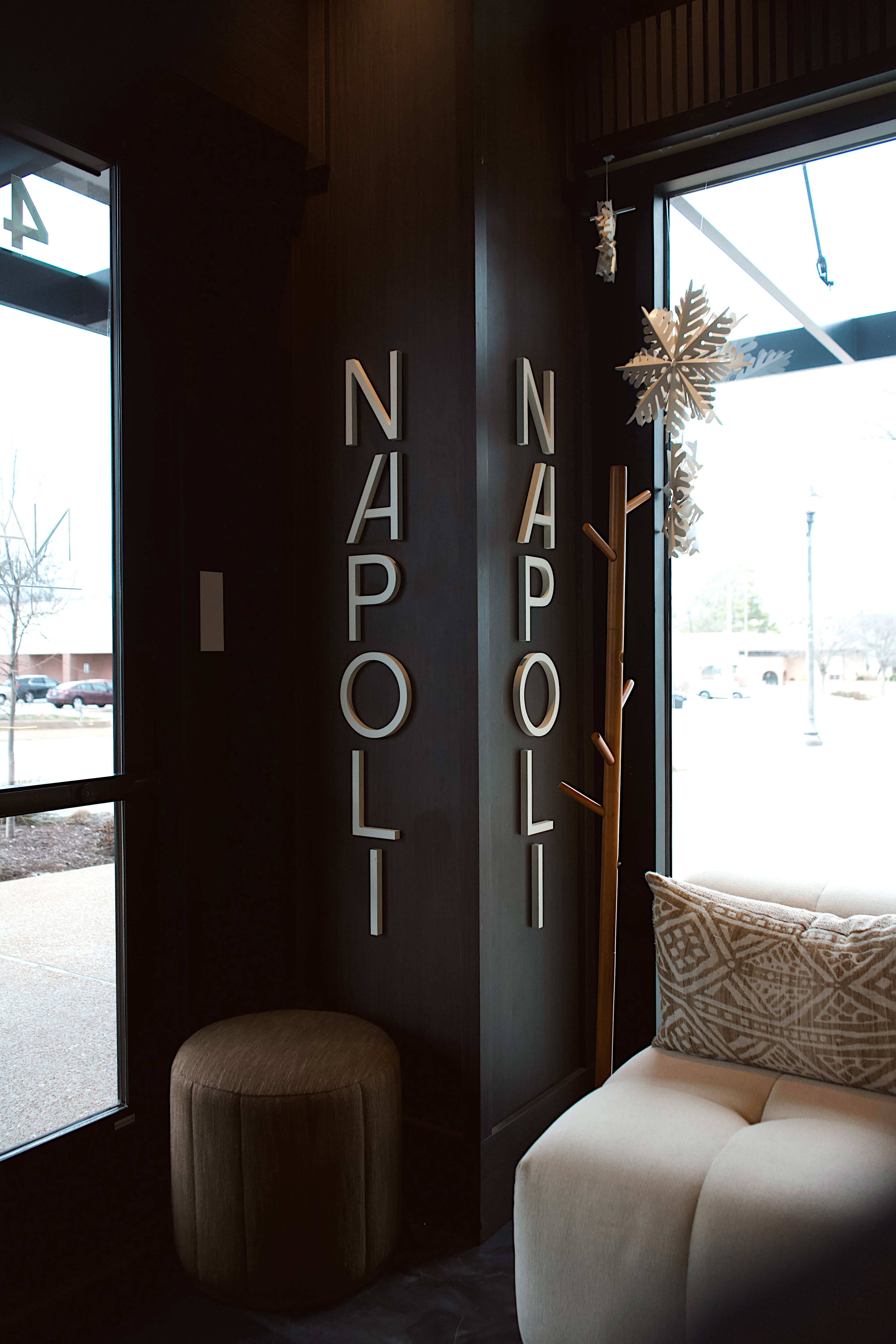a room with a black wall and a white couch