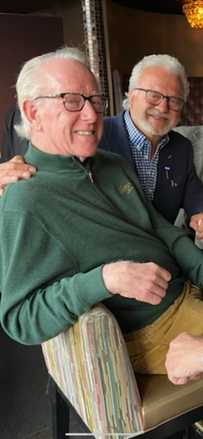 a group of people sitting posing for the camera