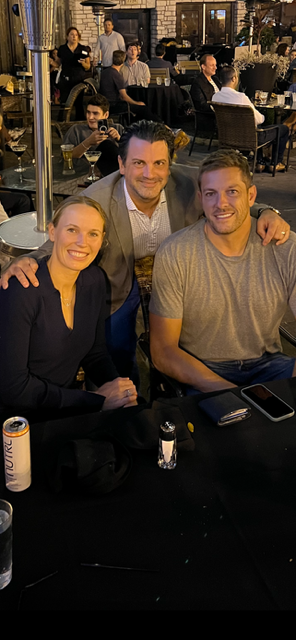 a group of people sitting at a table