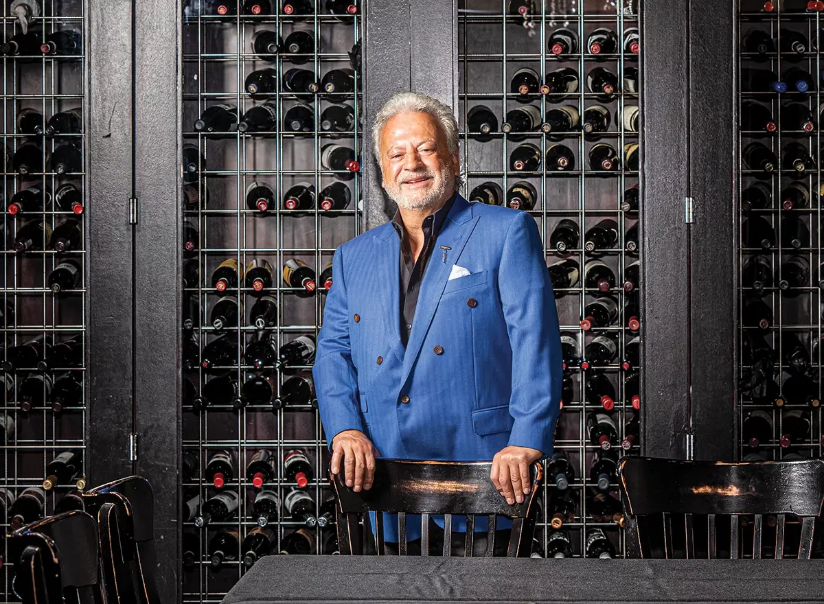 a man standing in front of a store