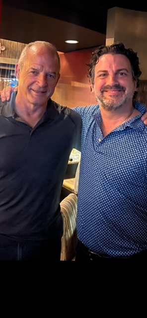 a couple of people posing for the camera